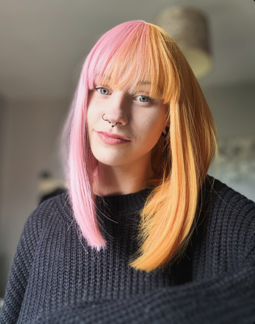 These super cute pastel pink and yellow colours are a fresh take on split colour. Split down the centre parting and carrying the colour through the fringe. Styled straight and sleek.