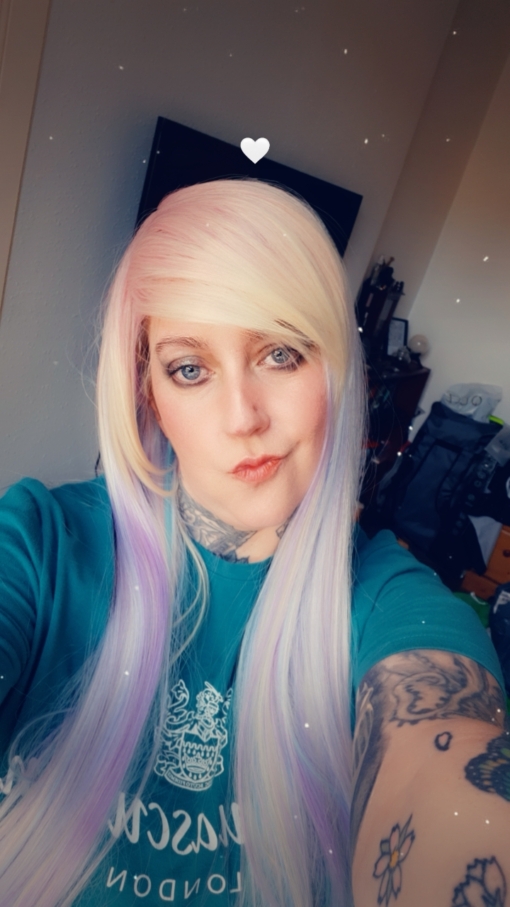 Sherbet Dip has a mixture of pastel colours that make this multi-colour wig. Pink roots melt into a mint green, blue, lilac and yellow blonde. Long and sleek with invisible layers for texture. The fringe is long and thick, wear it swept to the side or parted for long curtain bangs.