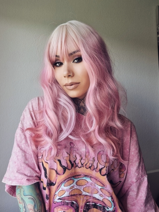 Looking for fix of pink! This gorgeous mix of pink waves and blonde roots adds a natural feel to the look. A light blonde fringe frames the face.