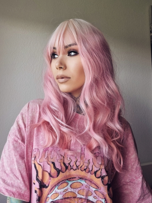 Looking for fix of pink! This gorgeous mix of pink waves and blonde roots adds a natural feel to the look. A light blonde fringe frames the face.