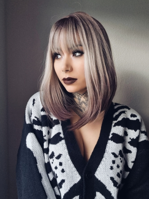 A sleek natural long bob (lob) with a light fringe. Carries dark brown shadowed roots that blend into this ash blonde colour. Finished off with a block of chocolate brown at the tips. 