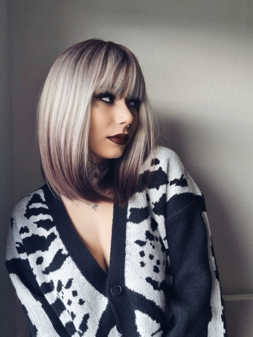 A sleek natural long bob (lob) with a light fringe. Carries dark brown shadowed roots that blend into this ash blonde colour. Finished off with a block of chocolate brown at the tips. 