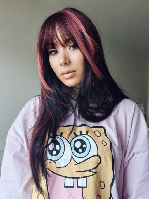 Stitch is cut into the hime style with blunt bangs. Sleek and long with a mix of dark pink and black. With a block of colour from the nape of the neck, to give a peek-a-boo effect.