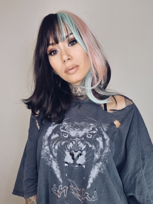 This vivid and bright wig has a natural twist of dark brown and pastel pink and blue. Blocks of colour set the look for this sleek long bob (lob) with a light blunt fringe that carries the colour.